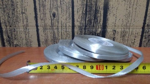 Wstążka satynowa 6mmx32m SREBRNA 4szt. Wstążka satynowa 6mmx32m SREBRNA 4szt.